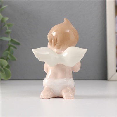 Сувенир керамика "Малыш-ангел сидит с белым сердцем" 7х6х10,5 см