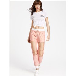 Розовые модные спортивные брюки на кулиске с разрезами